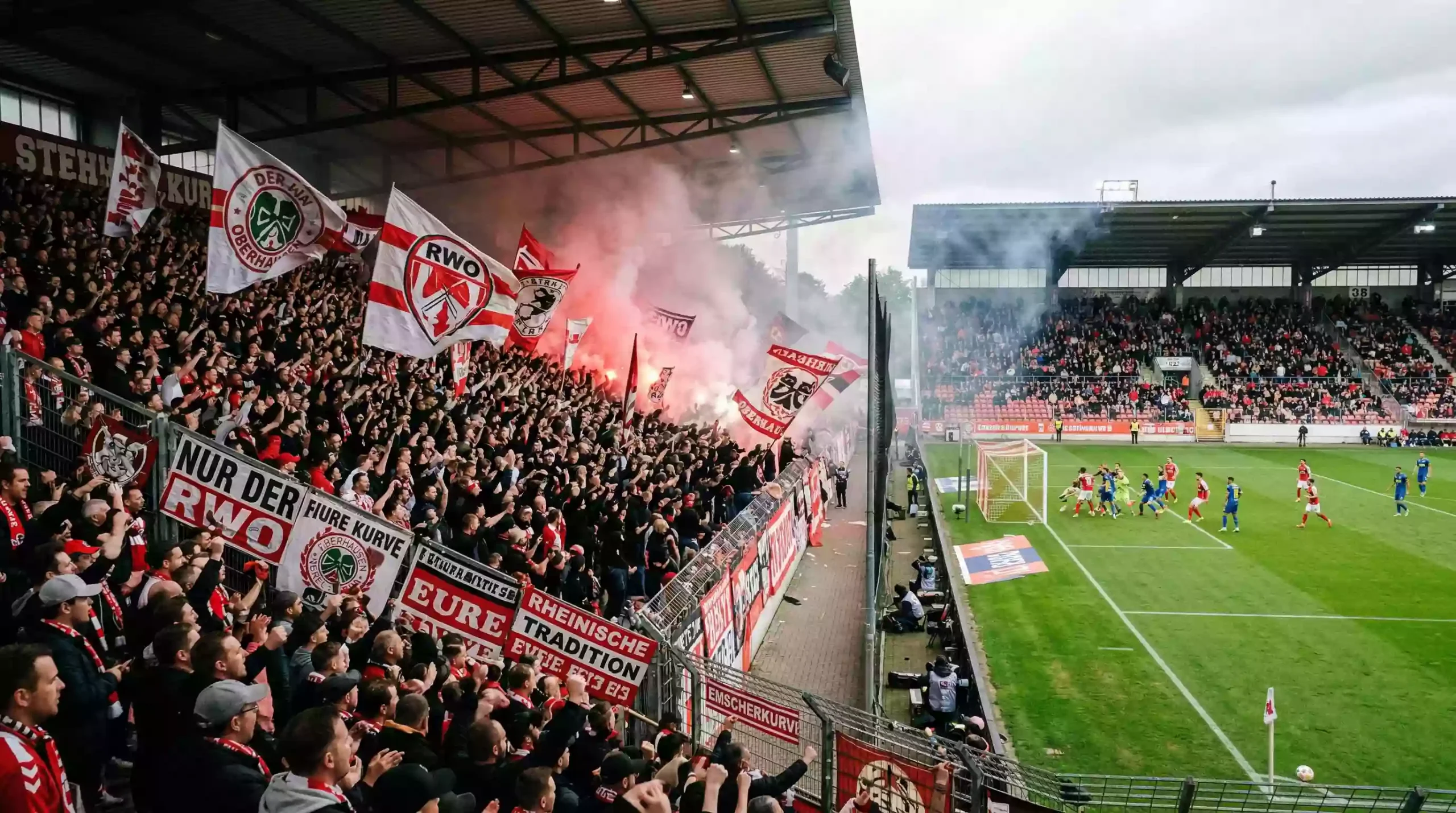 2. Bundesliga Tipps – volles Stadion eines Traditionsvereins mit Stehplätzen und Fahnen